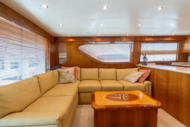 Slide: The Image of Luxurious interior of 2004 Hatteras 60 Convertible yacht with plush seating and elegant wood finishes. - 17