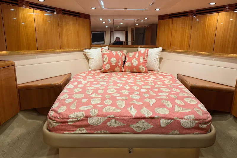 Slide: The Image of Luxurious bedroom interior of 2004 Hatteras 60 Convertible yacht with shell-patterned bedding. - 2