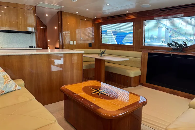 Slide: The Image of Luxurious interior of a 2004 Hatteras 60 Convertible yacht with elegant wood finishes. - 3