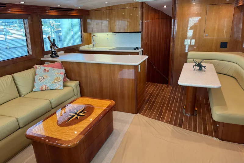 Slide: The Image of Luxurious interior of 2004 Hatteras 60 Convertible yacht with elegant wood finishes. - 54