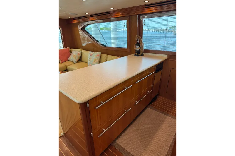 Slide: The Image of Luxurious interior of 2004 Hatteras 60 Convertible yacht with elegant wood cabinetry. - 55