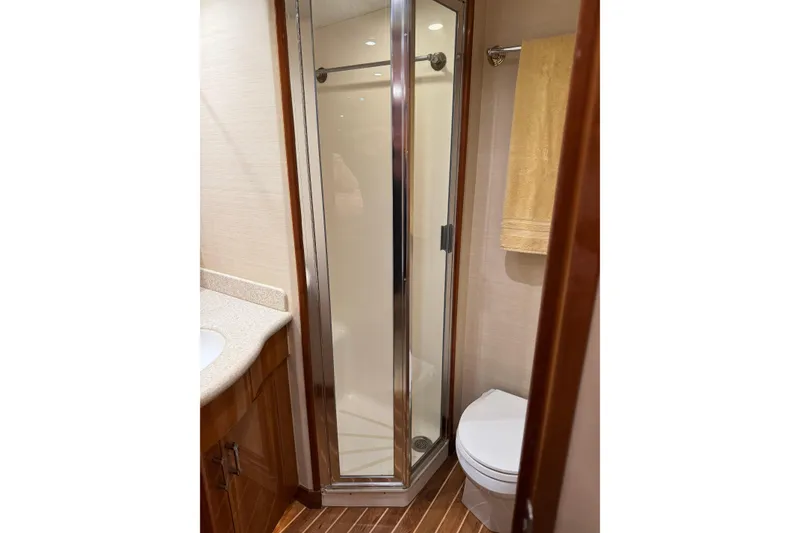 Slide: The Image of Bathroom interior of 2004 Hatteras 60 Convertible yacht with shower and toilet. - 66