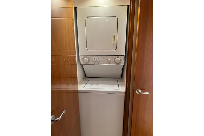 Slide: The Image of Stacked washer and dryer in 2004 Hatteras 60 Convertible yacht interior. - 67