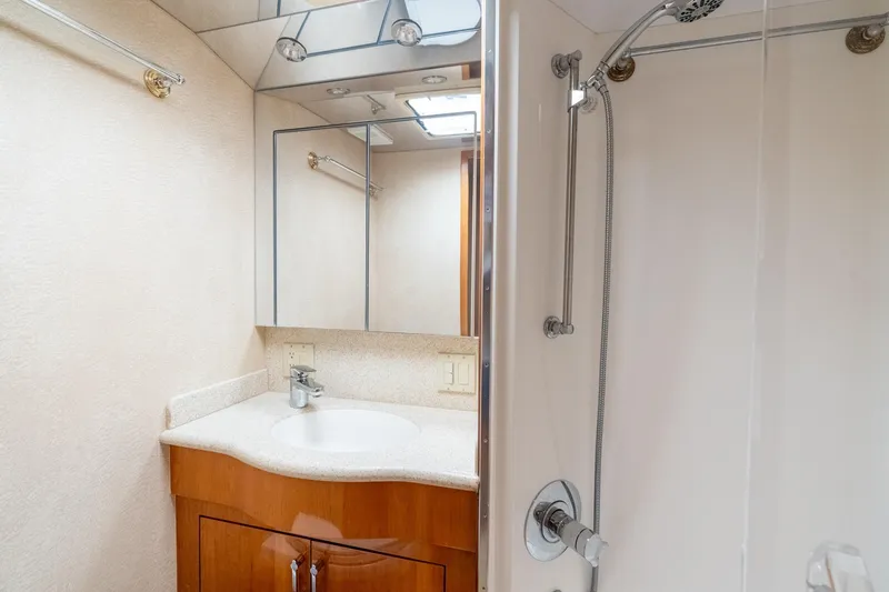 Slide: The Image of Luxurious bathroom in 2004 Hatteras 60 Convertible yacht with modern fixtures and shower. - 35