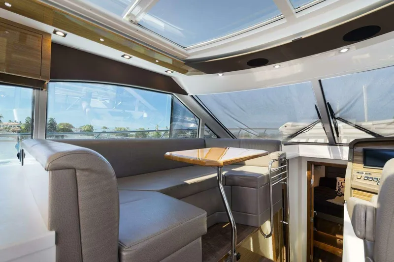 Slide: The Image of Luxurious interior of 2018 Cruisers Cantius 45 yacht with modern seating and panoramic windows. - 15