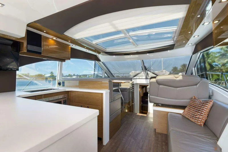 Slide: The Image of Luxurious interior of 2018 Cruisers Cantius 45 yacht with modern furnishings and panoramic windows. - 14