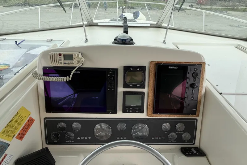 Slide: The Image of Control panel of a 1998 Pursuit 3400 Express boat with navigation instruments. - 10
