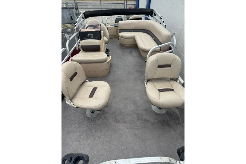 Slide: The Image of 2019 Sun Tracker Bass Buggy 18 DLX pontoon boat interior with beige seating. - 5