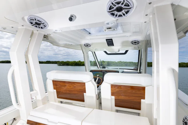 Slide: The Image of Interior view of 2026 Pursuit S 328 Sport boat, featuring sleek design and modern amenities. - 13