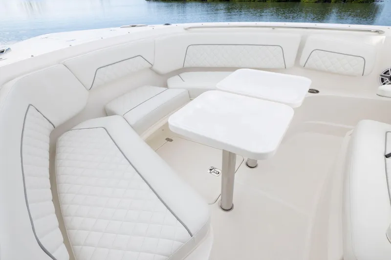 Slide: The Image of Luxurious seating area on the 2026 Pursuit S 328 Sport boat, featuring elegant white upholstery. - 23