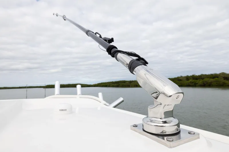 Slide: The Image of Fishing rod holder on 2026 Pursuit S 328 Sport boat, overlooking calm waters. - 29