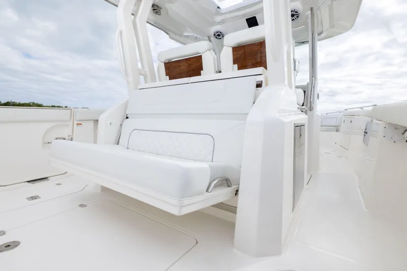 Slide: The Image of 2026 Pursuit S 328 Sport boat interior with white seating and sleek design. - 9