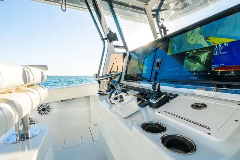 Slide: The Image of Interior view of 2022 Freeman 42LR boat cockpit with advanced navigation displays. - 29