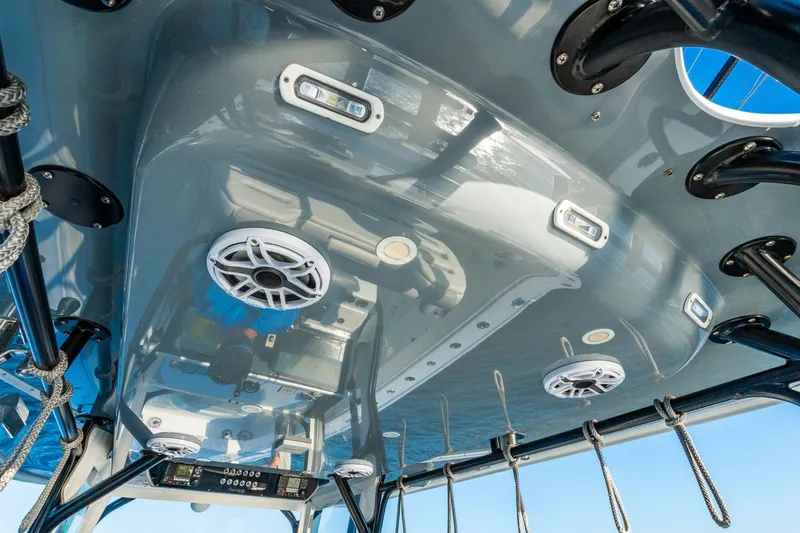 Slide: The Image of Interior view of a 2022 Freeman 42LR boat's ceiling with speakers and lighting. - 32