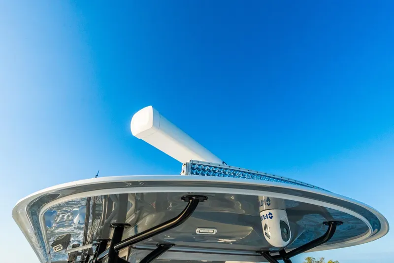 Slide: The Image of Rooftop view of a 2022 Freeman 42LR boat against a clear blue sky. - 43