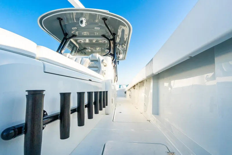 Slide: The Image of Freeman 42LR 2022 boat deck with rod holders and sleek design. - 59