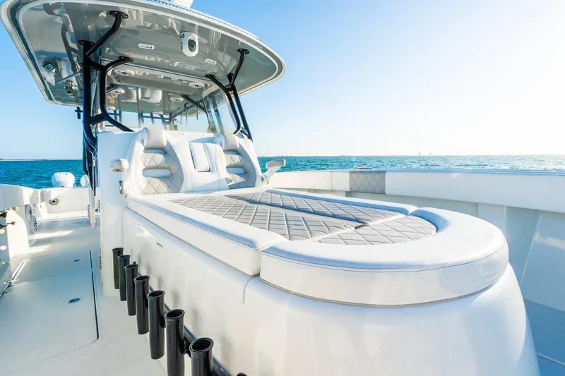 Slide: The Image of Luxurious 2022 Freeman 42LR boat interior with cushioned seating, ocean backdrop. - 60