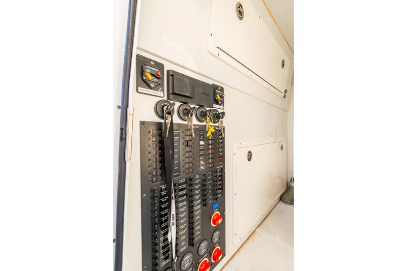 Slide: The Image of Control panel inside a 2022 Freeman 42LR boat, featuring switches and gauges. - 62