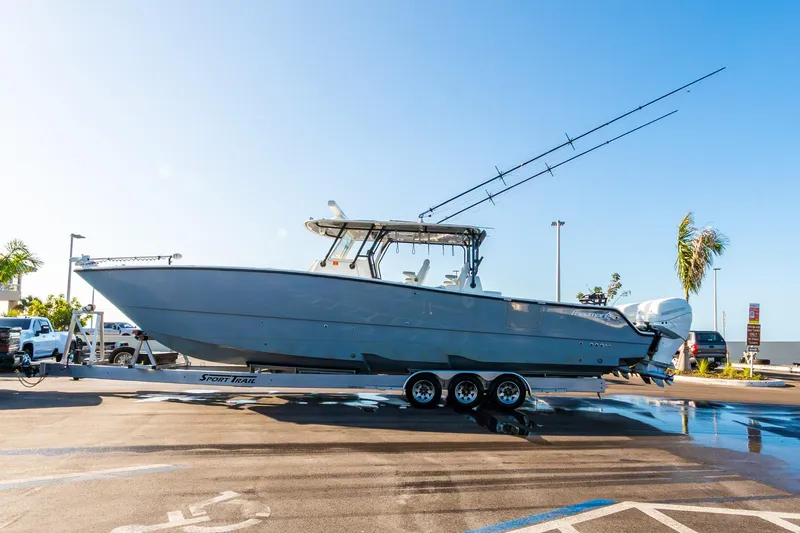 Slide: The Image of 2022 Freeman 42LR boat on trailer in sunny parking lot. - 65