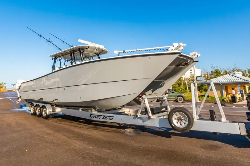 Slide: The Image of 2022 Freeman 42LR boat on Sport Trail trailer in sunny parking lot. - 71