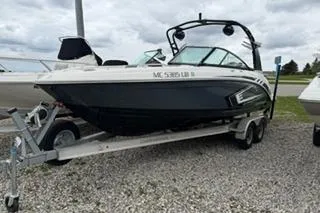 The Image of 2018 Chapparall Vortex 223 VRX boat on trailer, parked on gravel. - 1
