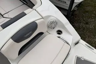 Slide: The Image of 2018 Chapparall Vortex 223 VRX boat interior with cushioned seating and speaker. - 17