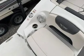 Slide: The Image of 2018 Chapparall Vortex 223 VRX boat interior with seating and speaker detail. - 18