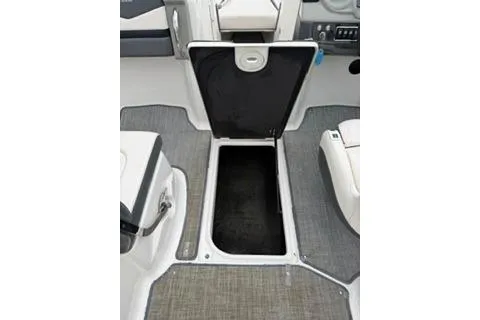 Slide: The Image of 2018 Chapparall Vortex 223 VRX boat interior storage compartment open. - 19