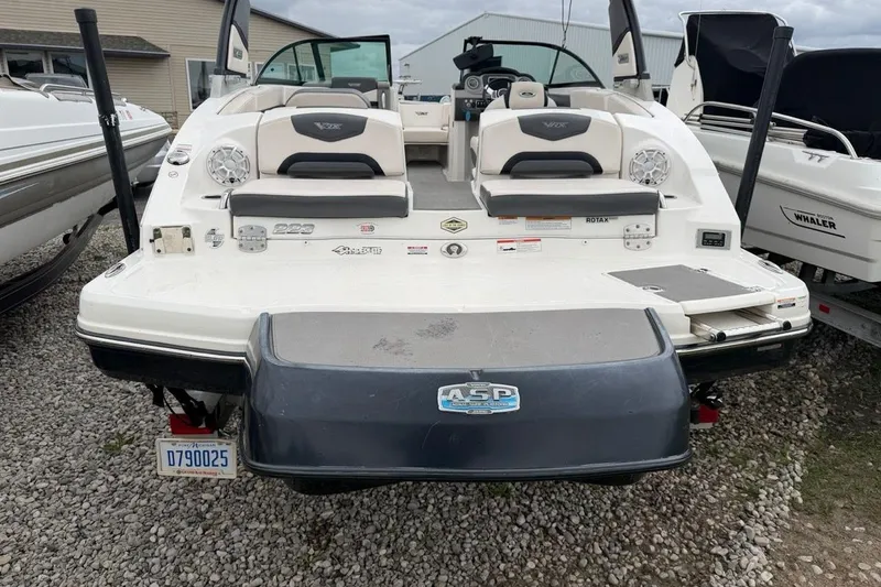 Slide: The Image of 2018 Chaparral Vortex 223 VRX boat rear view, showcasing seating and swim platform. - 1