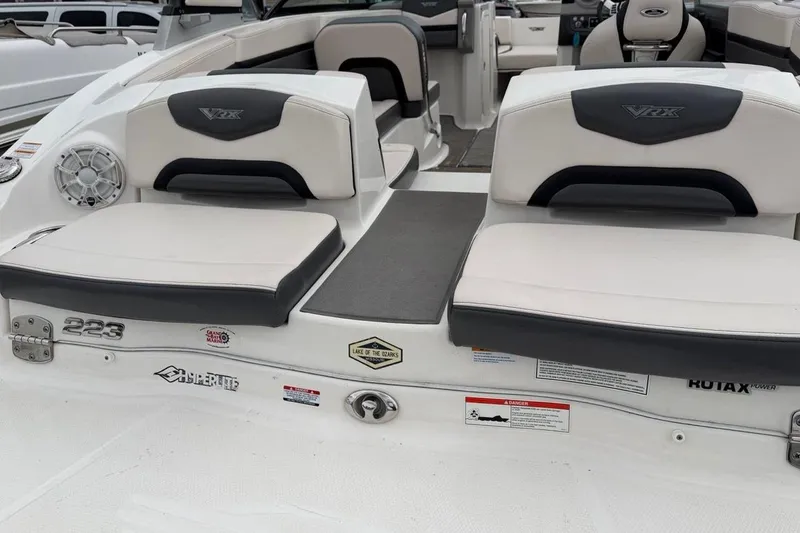 Slide: The Image of 2018 Chaparral Vortex 223 VRX boat interior with seating and branding details. - 2
