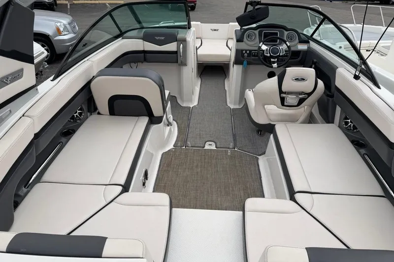 Slide: The Image of 2018 Chaparral Vortex 223 VRX boat interior with spacious seating and modern dashboard. - 3
