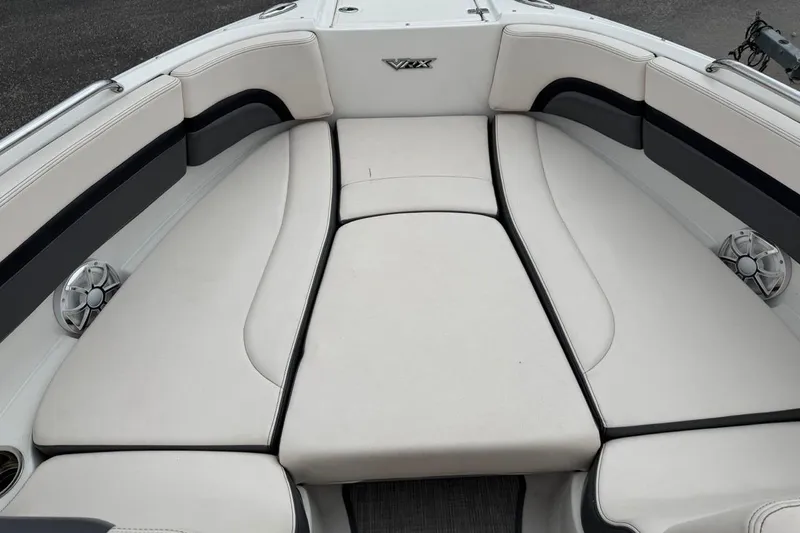 Slide: The Image of 2018 Chaparral Vortex 223 VRX boat interior with cushioned seating and speakers. - 9