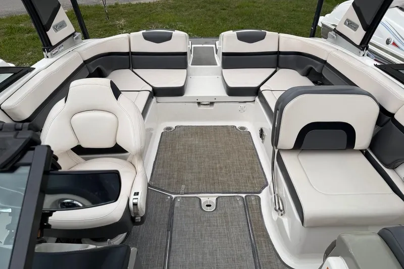 Slide: The Image of 2018 Chaparral Vortex 223 VRX boat interior with plush seating and modern design. - 10