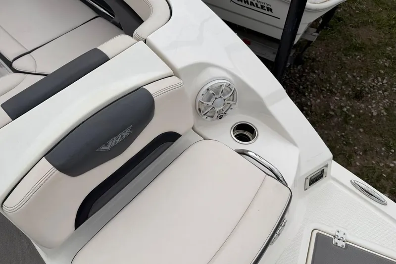 Slide: The Image of 2018 Chaparral Vortex 223 VRX boat interior with seating and speaker detail. - 16