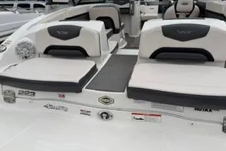 Slide: The Image of 2018 Chapparall Vortex 223 VRX boat interior with cushioned seating and sleek design. - 4