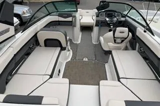 Slide: The Image of 2018 Chapparall Vortex 223 VRX boat interior with spacious seating and modern dashboard. - 5