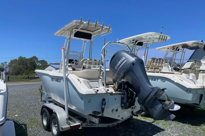 Slide: The Image of 2023 Key West 203 FS boat with Yamaha outboard motor on trailer. - 2