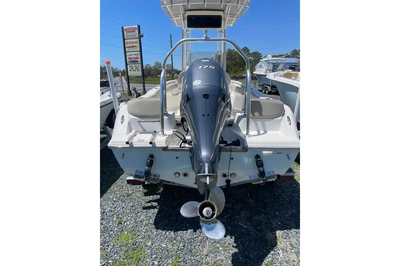 Slide: The Image of 2023 Key West 203 FS boat with Yamaha outboard motor displayed outdoors. - 5