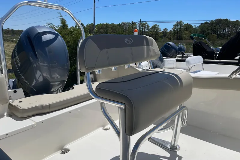 Slide: The Image of 2023 Key West 203 FS boat with Yamaha engine and cushioned seating. - 9