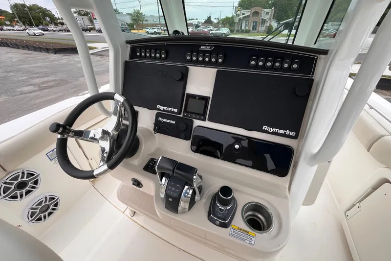 Slide: The Image of 2020 Boston Whaler 280 Outrage helm with Raymarine electronics and modern steering controls. - 10