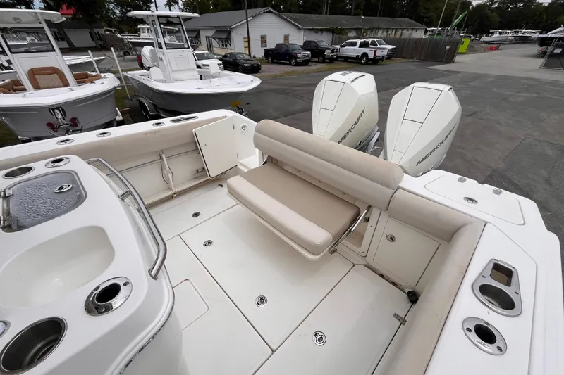 Slide: The Image of 2020 Boston Whaler 280 Outrage boat interior with seating and dual Mercury engines. - 18