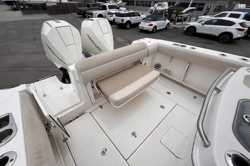 Slide: The Image of 2020 Boston Whaler 280 Outrage boat with dual Mercury engines and spacious seating area. - 7