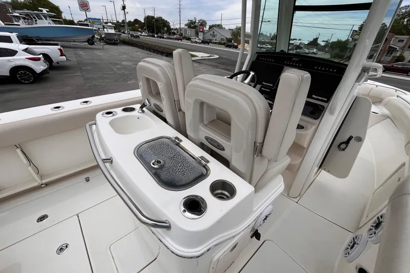 Slide: The Image of 2020 Boston Whaler 280 Outrage boat interior with helm seats and fishing station. - 8
