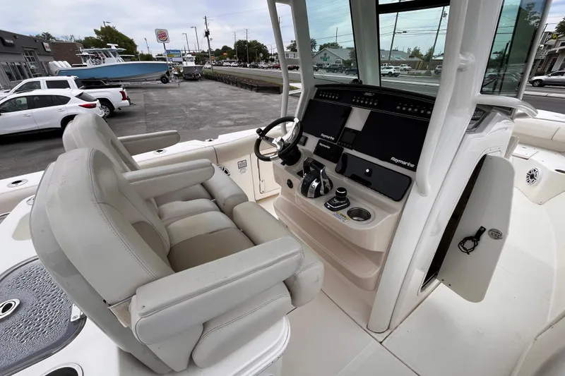Slide: The Image of 2020 Boston Whaler 280 Outrage boat interior with dual seats and advanced navigation system. - 9