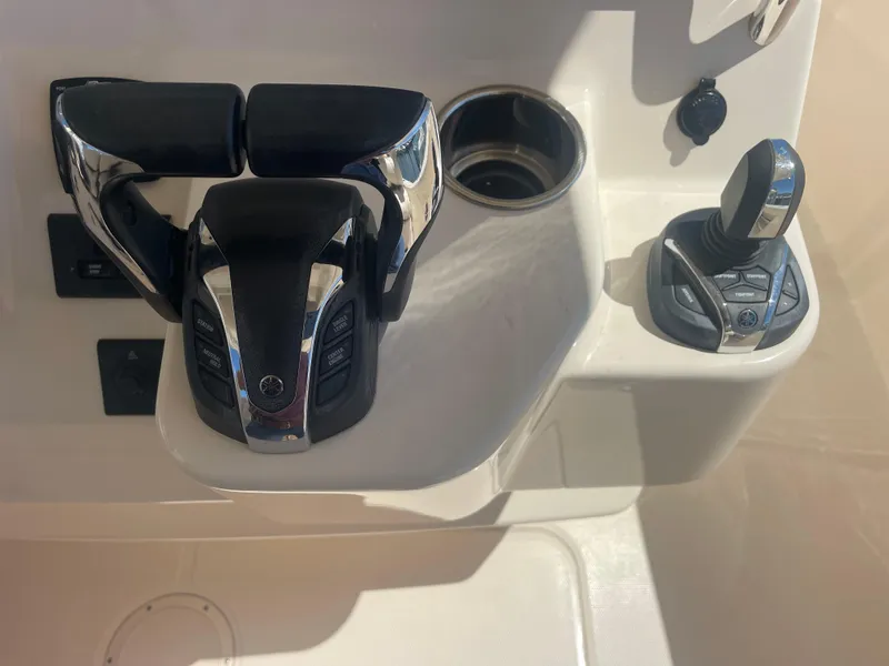 Slide: The Image of 2021 Grady-White Canyon 326 boat controls and joystick. - 15