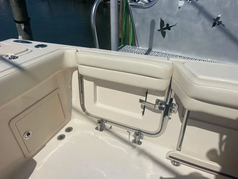 Slide: The Image of 2021 Grady-White Canyon 326 boat with beige seating area. - 18
