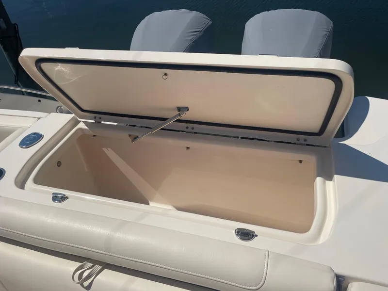 Slide: The Image of Open storage compartment on a 2021 Grady-White Canyon 326 boat. - 19