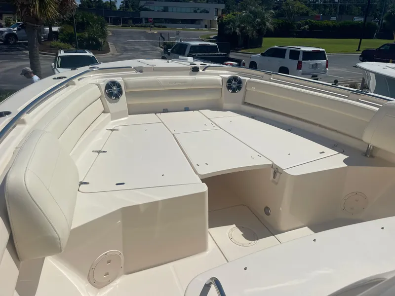 Slide: The Image of 2021 Grady-White Canyon 326 boat with spacious deck and seating area. - 5