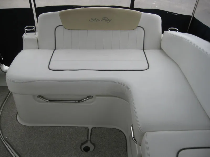 Slide: The Image of Interior of 2009 Sea Ray 270 Sundancer with white seating area. - 10