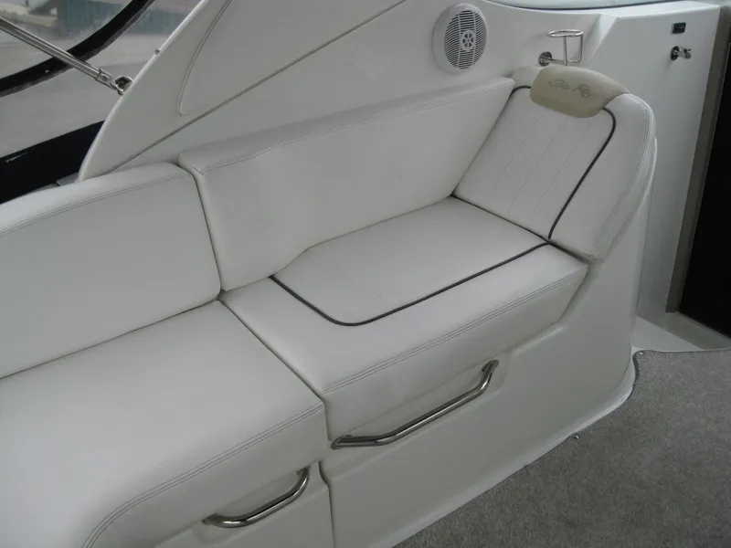 Slide: The Image of Interior of 2009 Sea Ray 270 Sundancer with white seating area. - 11